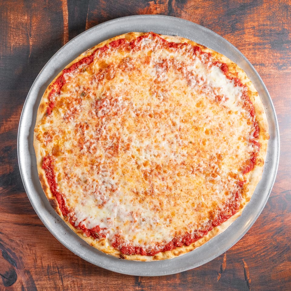 A classic cheese pizza with red sauce and melted mozzarella on a metal pan.